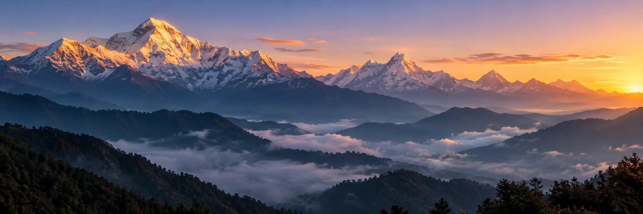 Sunrise illuminating the Himalayan peaks and misty foothills of Nepal